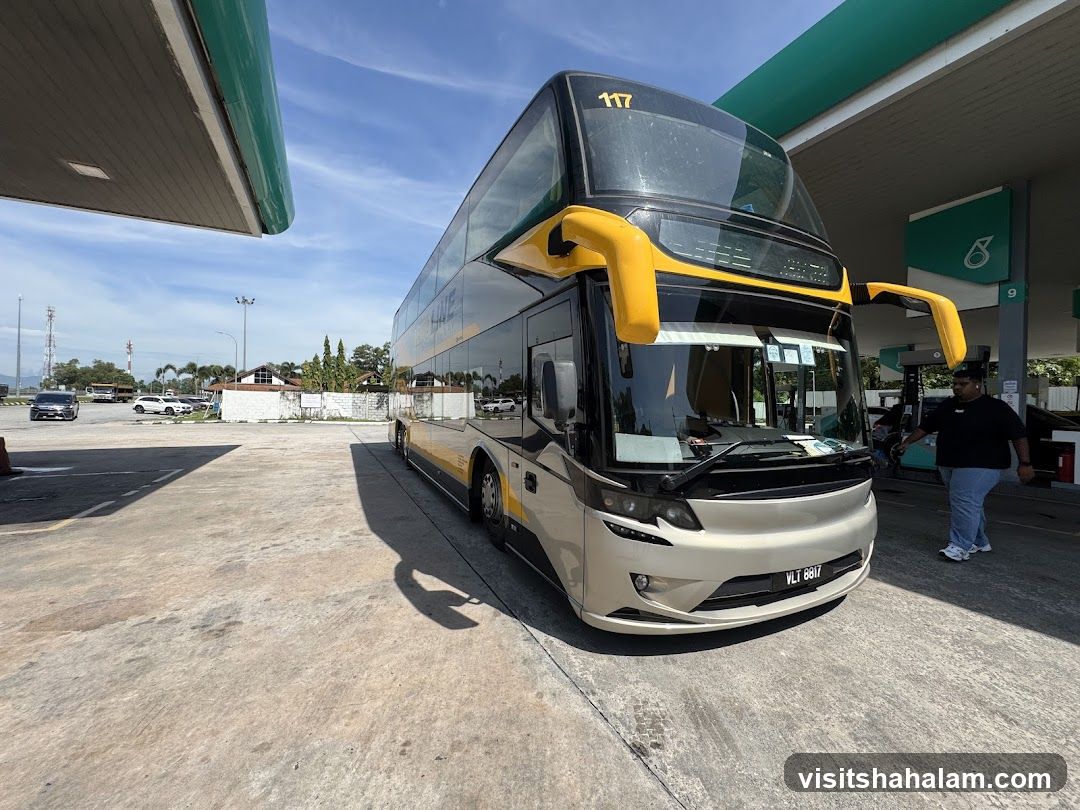 Double-decker bus at a gas station