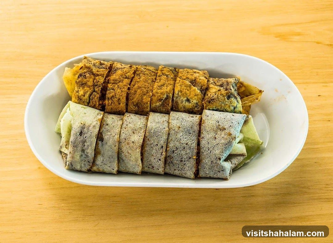 Two types of spring rolls on a white plate