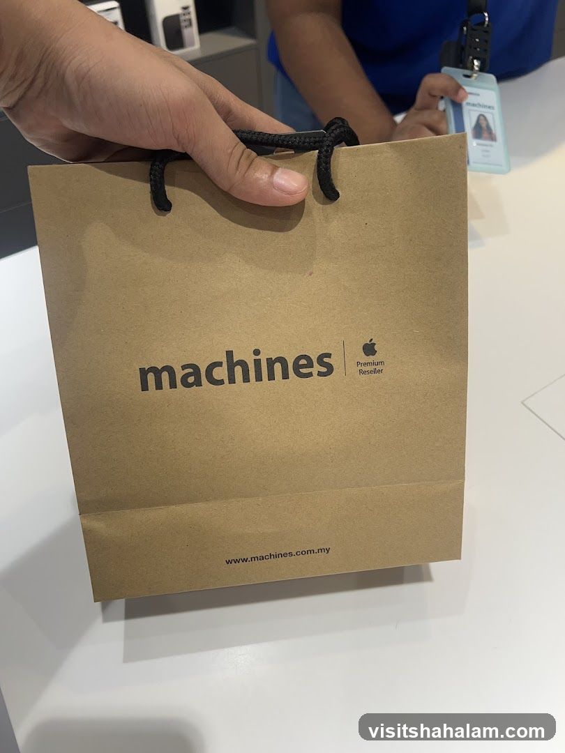 Brown paper shopping bag with "machines" logo