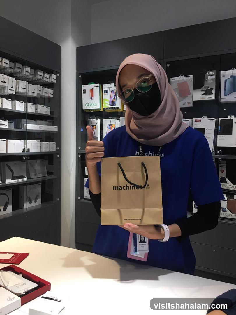 Employee holding a shopping bag