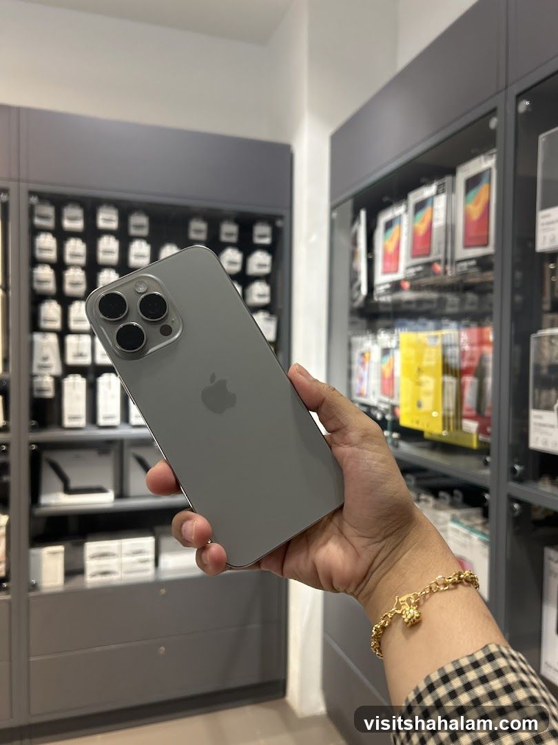 Person holding a smartphone in a store
