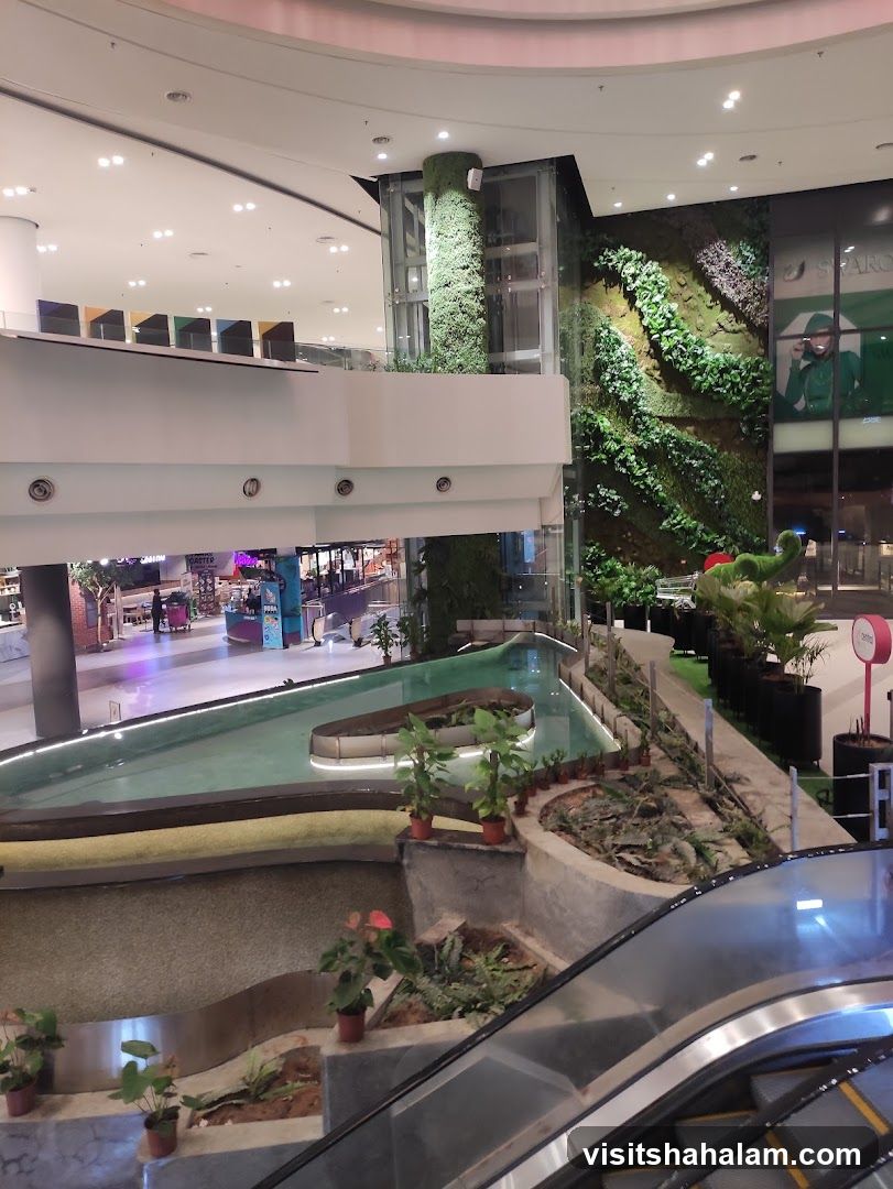 Indoor mall with greenery and water feature