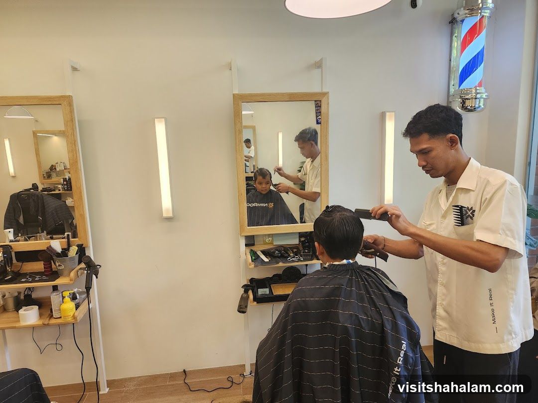 Barber cutting a child's hair