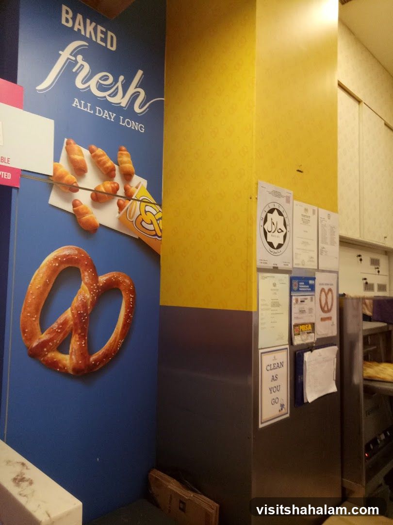 Pretzel shop interior with promotional art and certifications