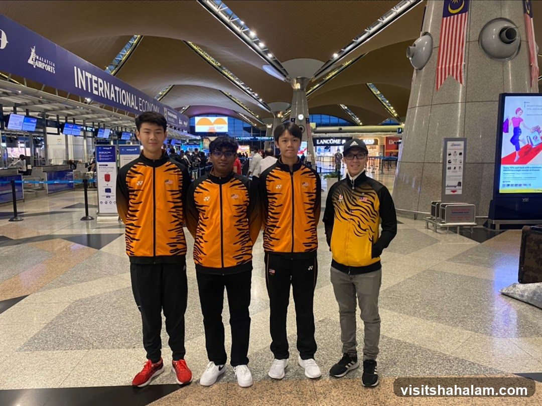 Four young men in athletic wear