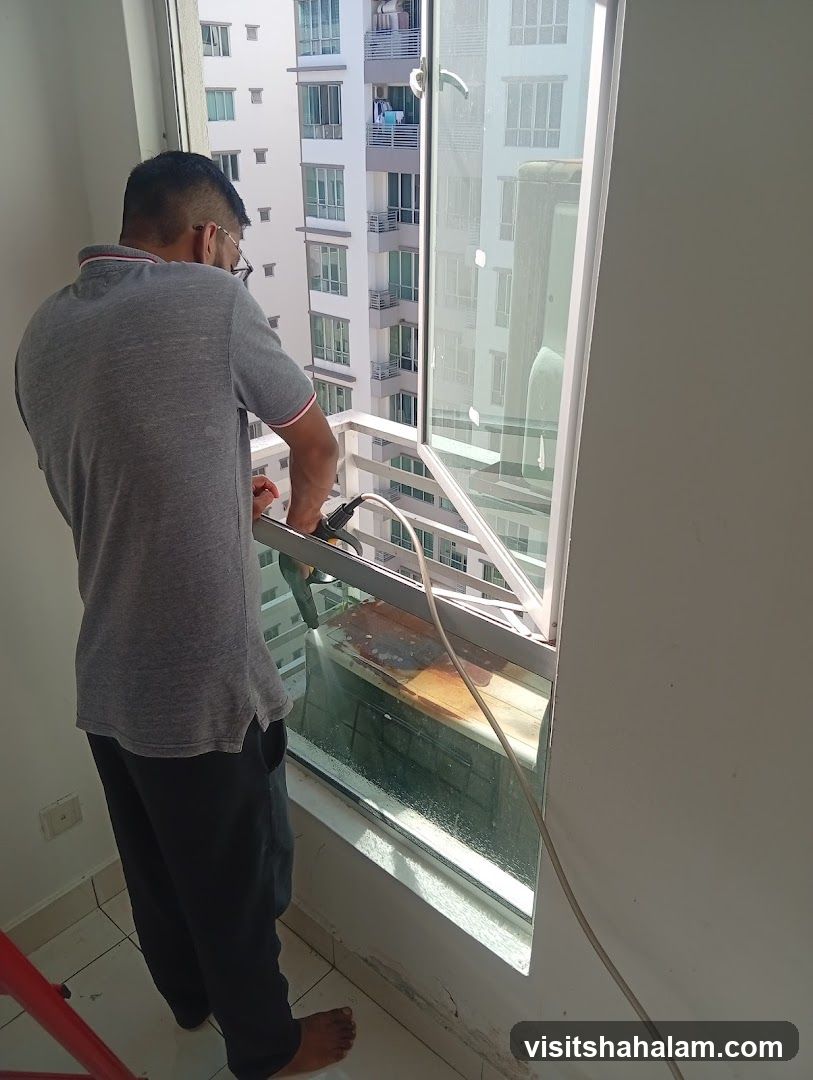 Man cleaning window