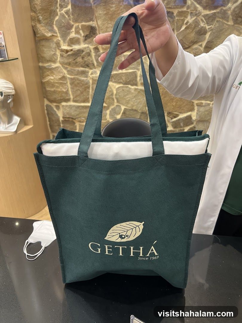Person holding a branded tote bag