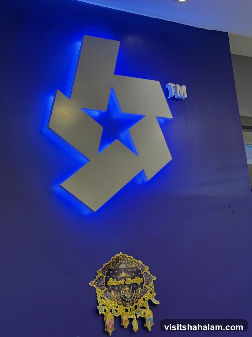 Logo and decorative item on blue wall