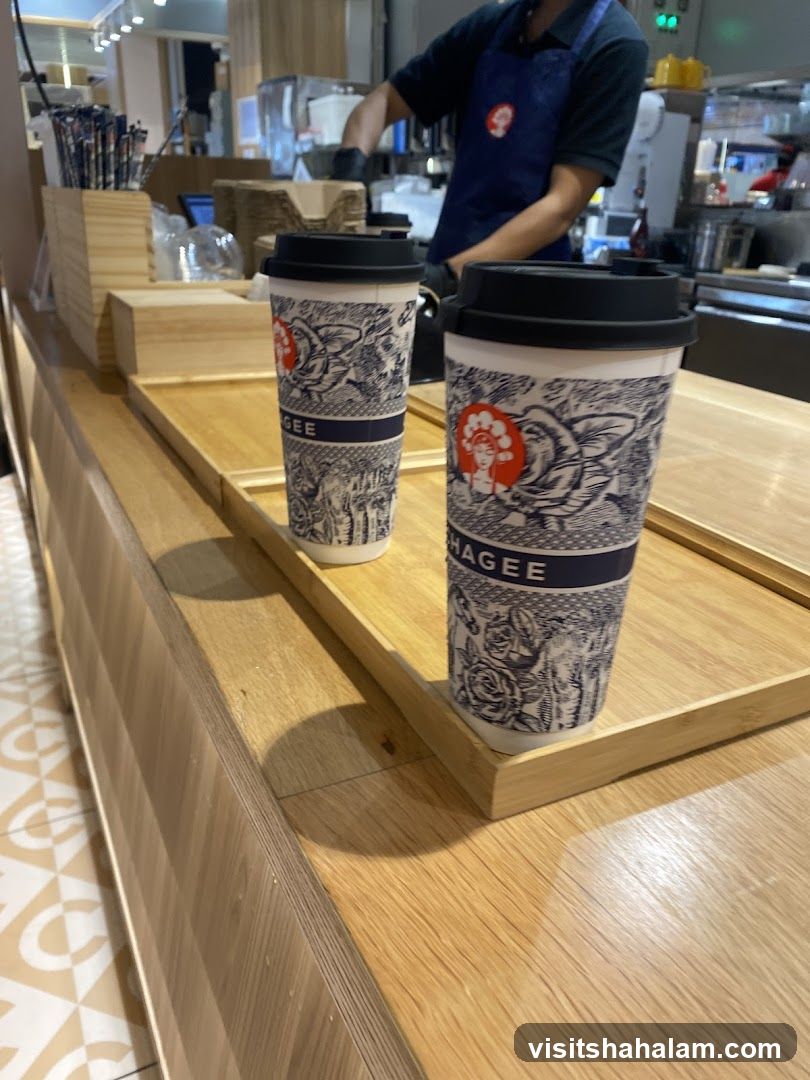 Two coffee cups on a wooden counter