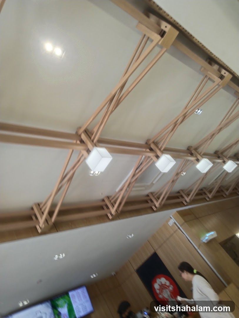 Interior of a building with wooden beams and lights