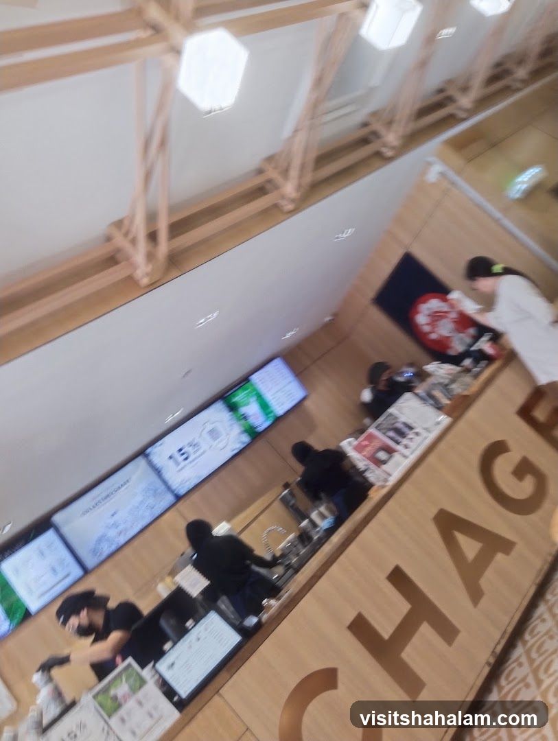 Cafe Interior with Staff and Digital Menus