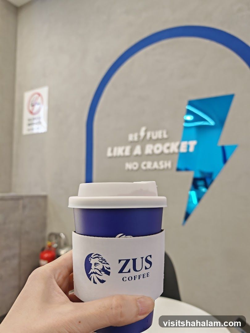 Coffee Cup with ZUS Coffee Logo