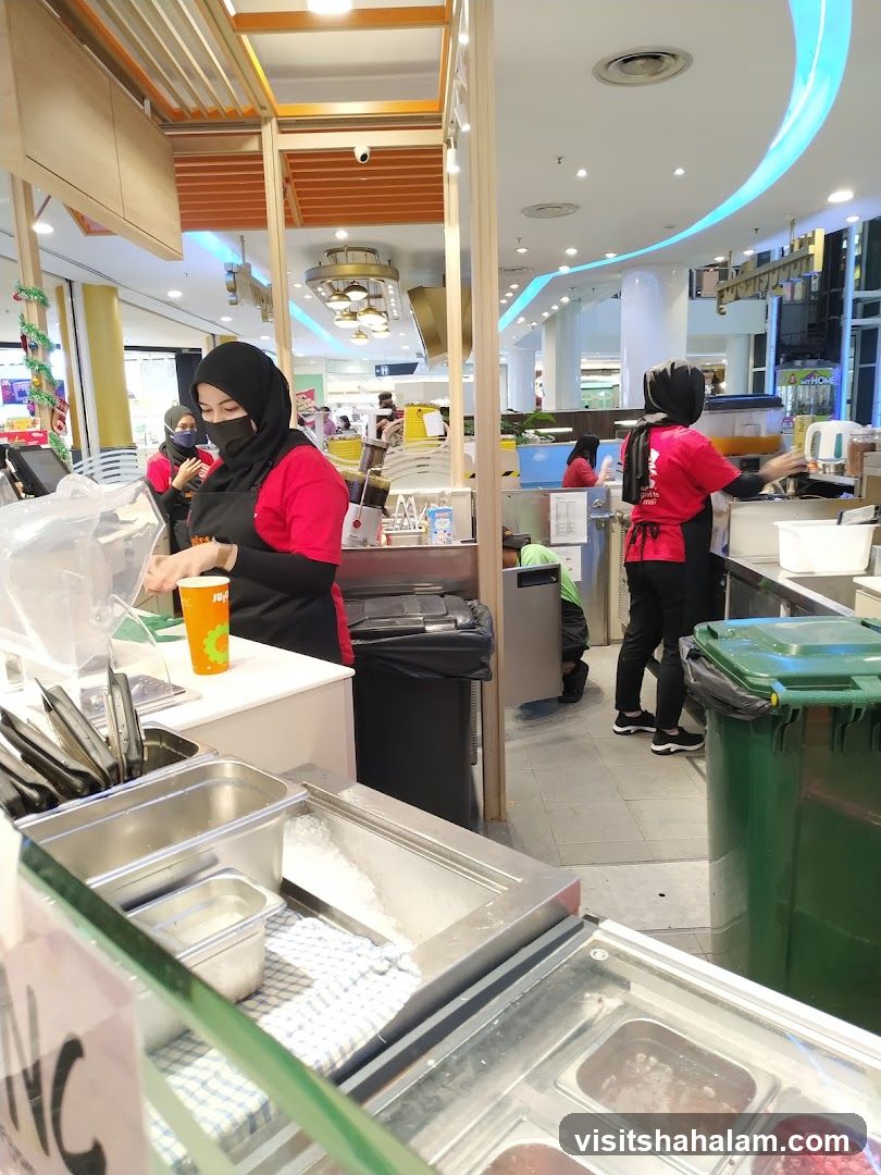 Food stall workers preparing orders