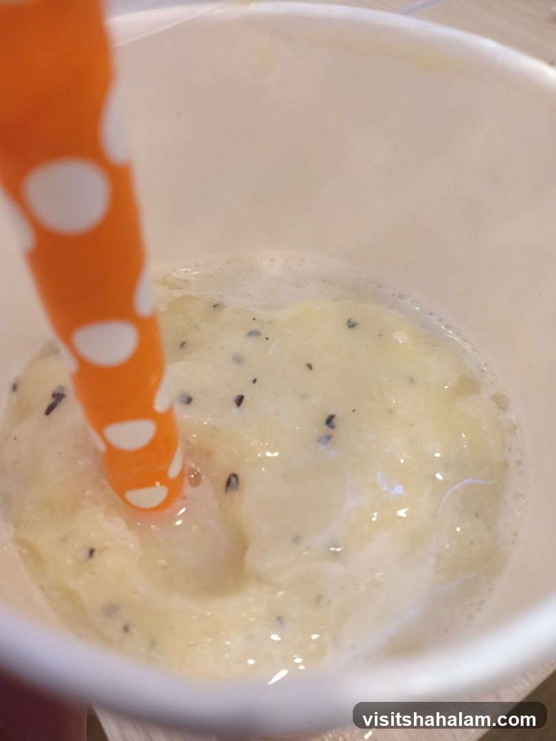 Close-up of a smoothie with a straw