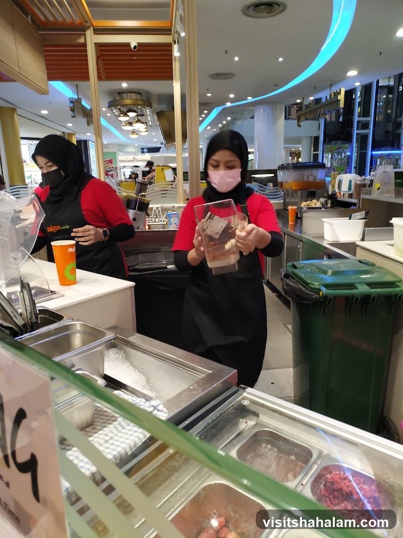 Juice Bar Staff Preparing Drinks