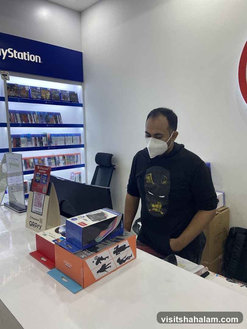 Man in a store with PlayStation merchandise