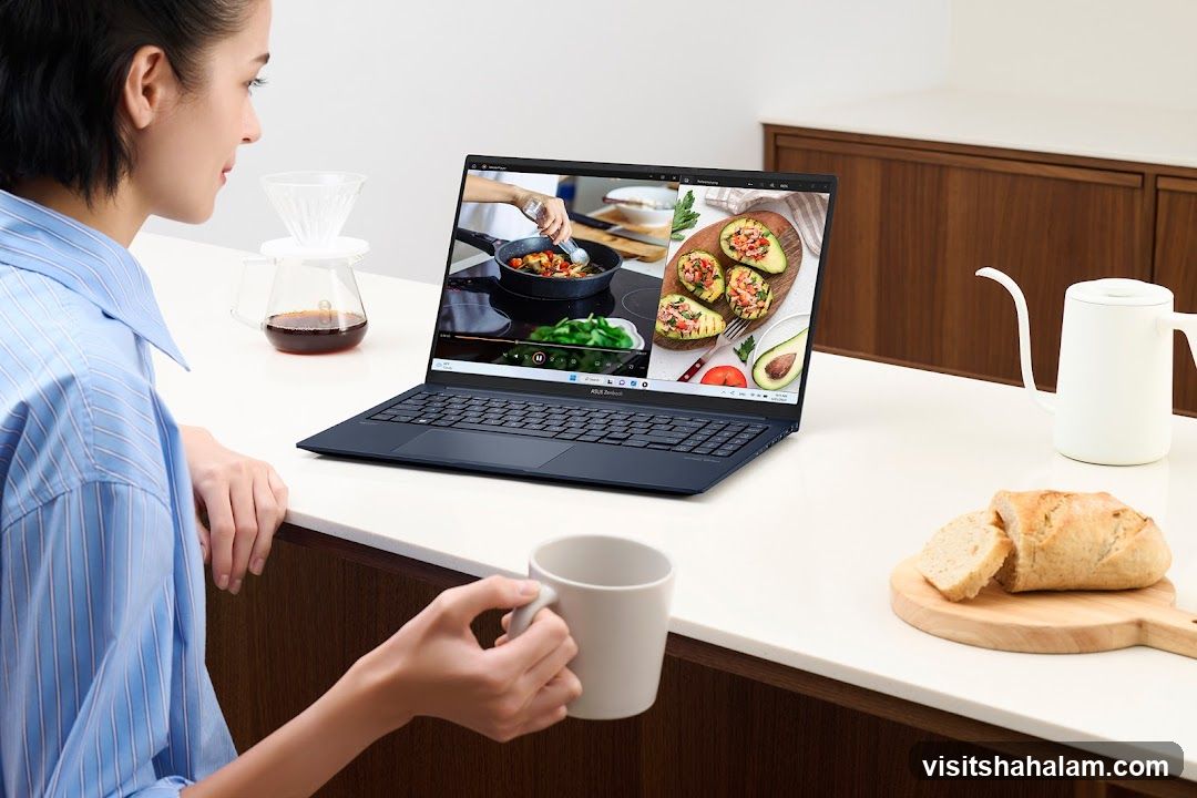 Woman watching cooking video on laptop