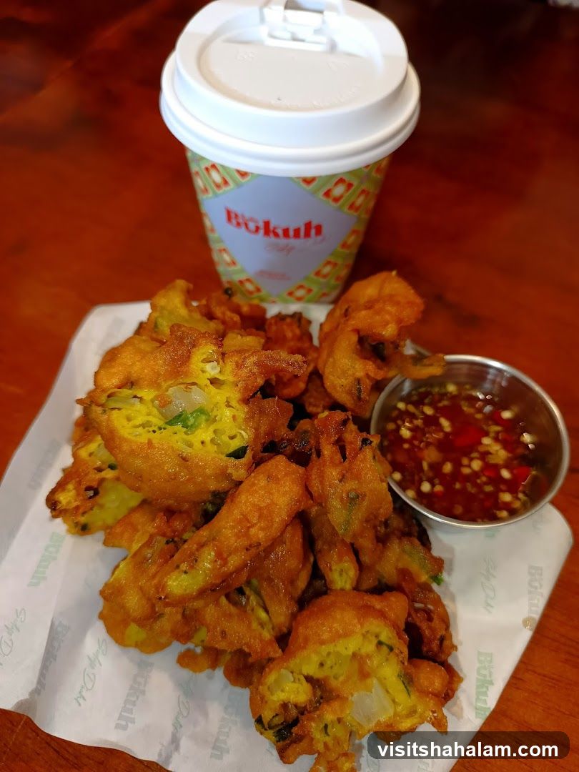 Fried Snacks with Dipping Sauce and Coffee Cup