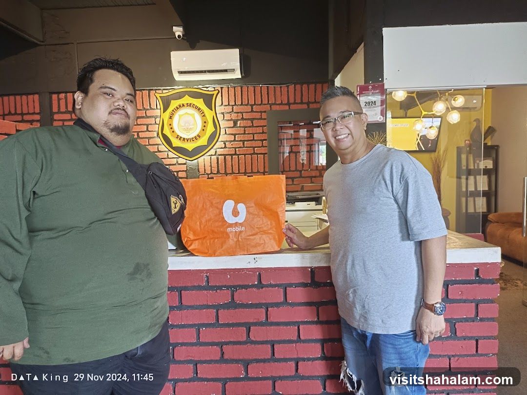 Two men with a shopping bag