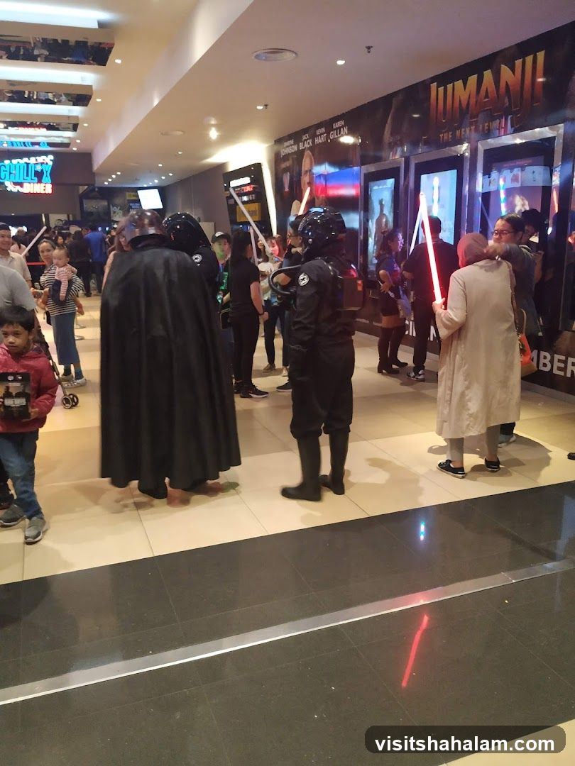 People in costumes at a movie theater