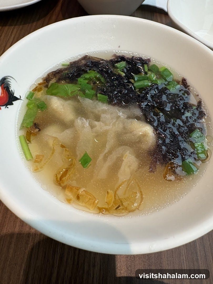 Bowl of Soup with Seaweed and Scallions
