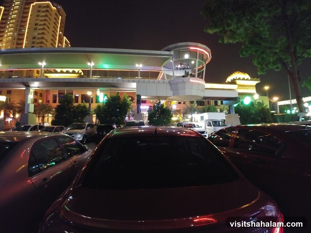 Nighttime view of a shopping complex parking lot