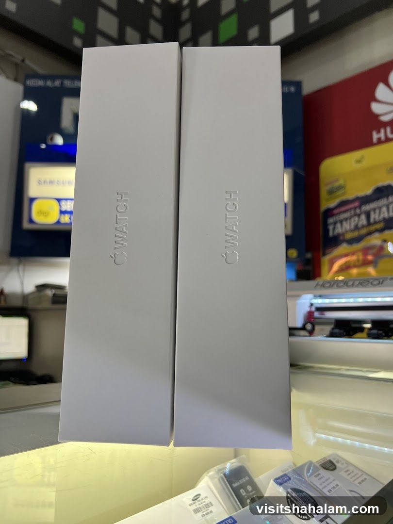 Two white boxes with "WATCH" and Apple logo