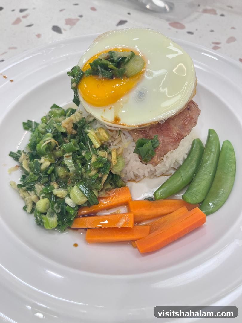 Rice dish with fried egg and vegetables