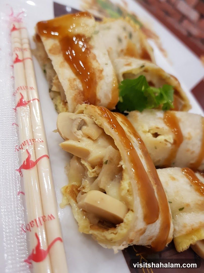 Rolled Crepes with Mushrooms and Sauce