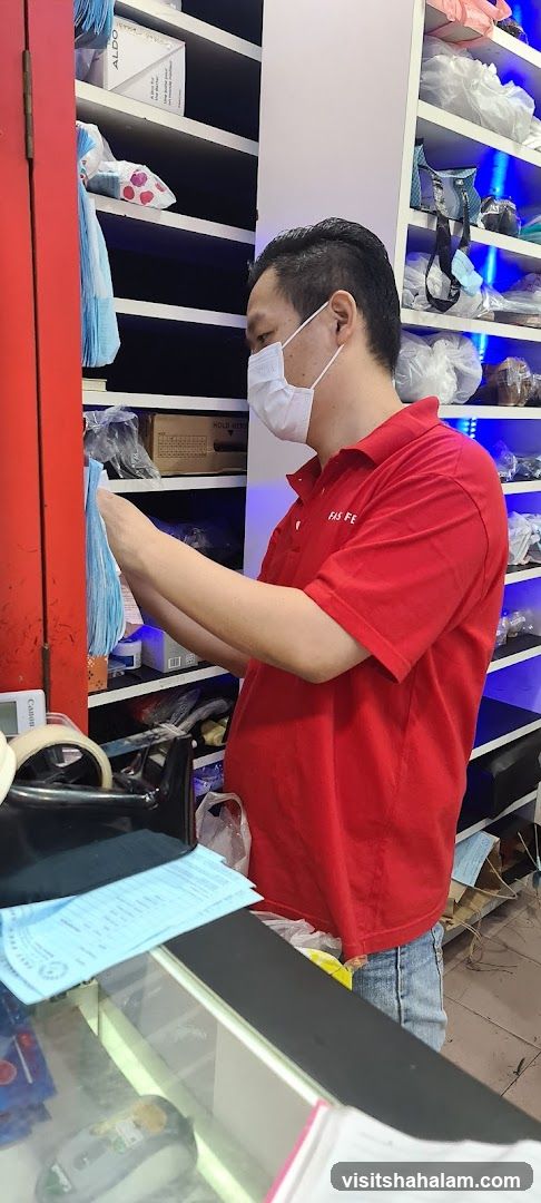 Man in Red Shirt Working