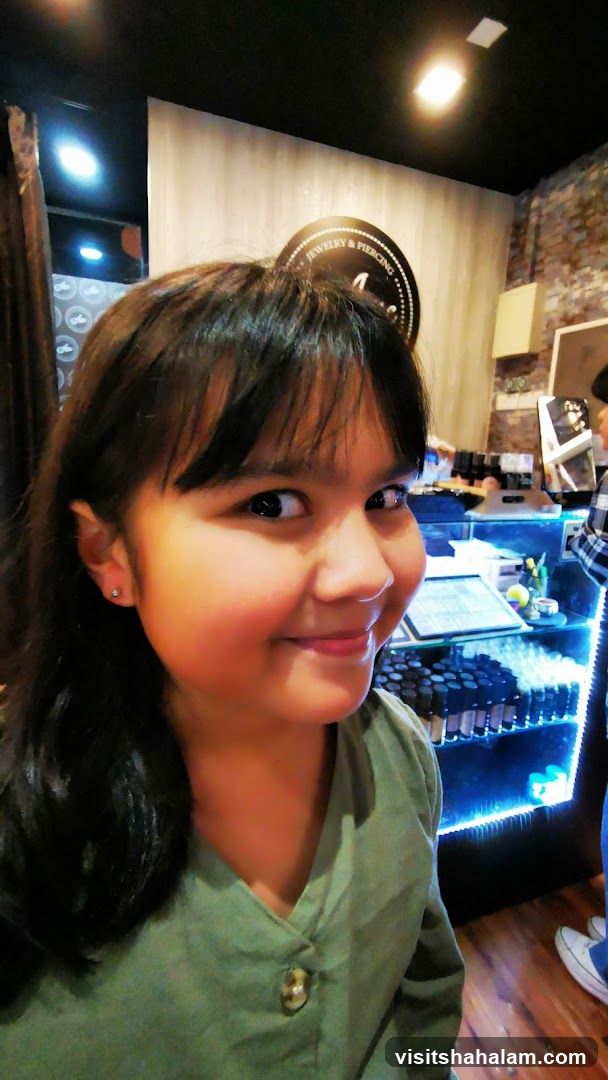 Young Girl in Jewelry and Piercing Shop