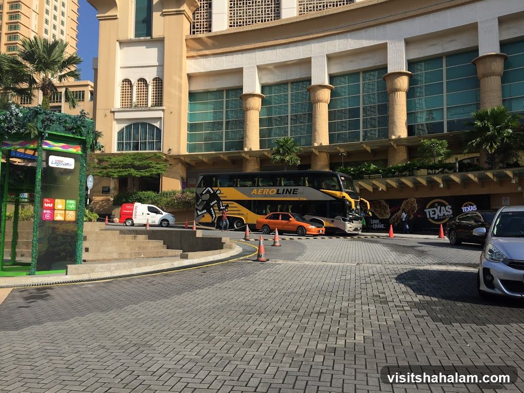 Bus and Cars Outside Building