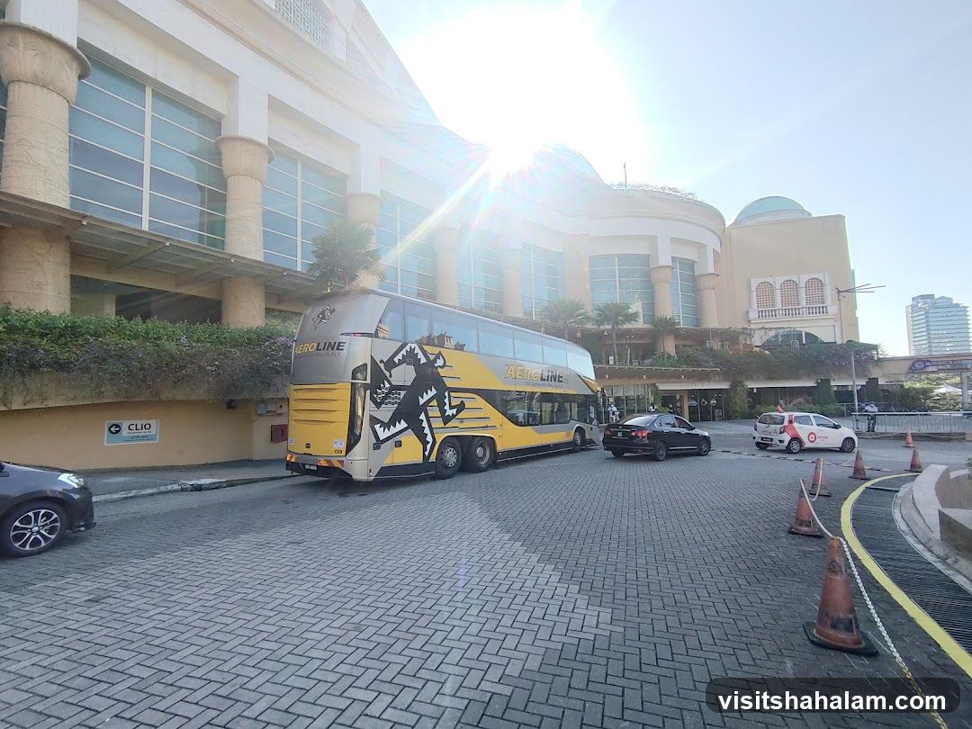 Double-decker bus parked in front of a building
