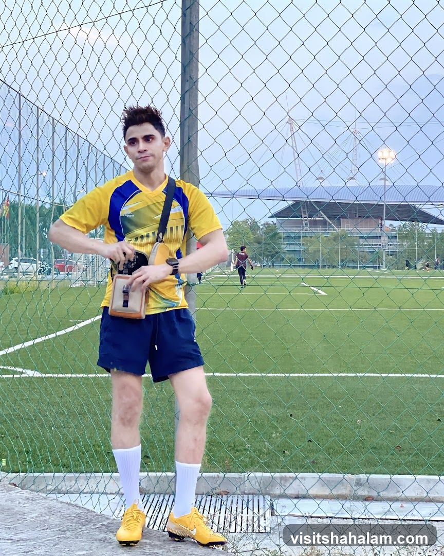 Man in Yellow Jersey at Soccer Field