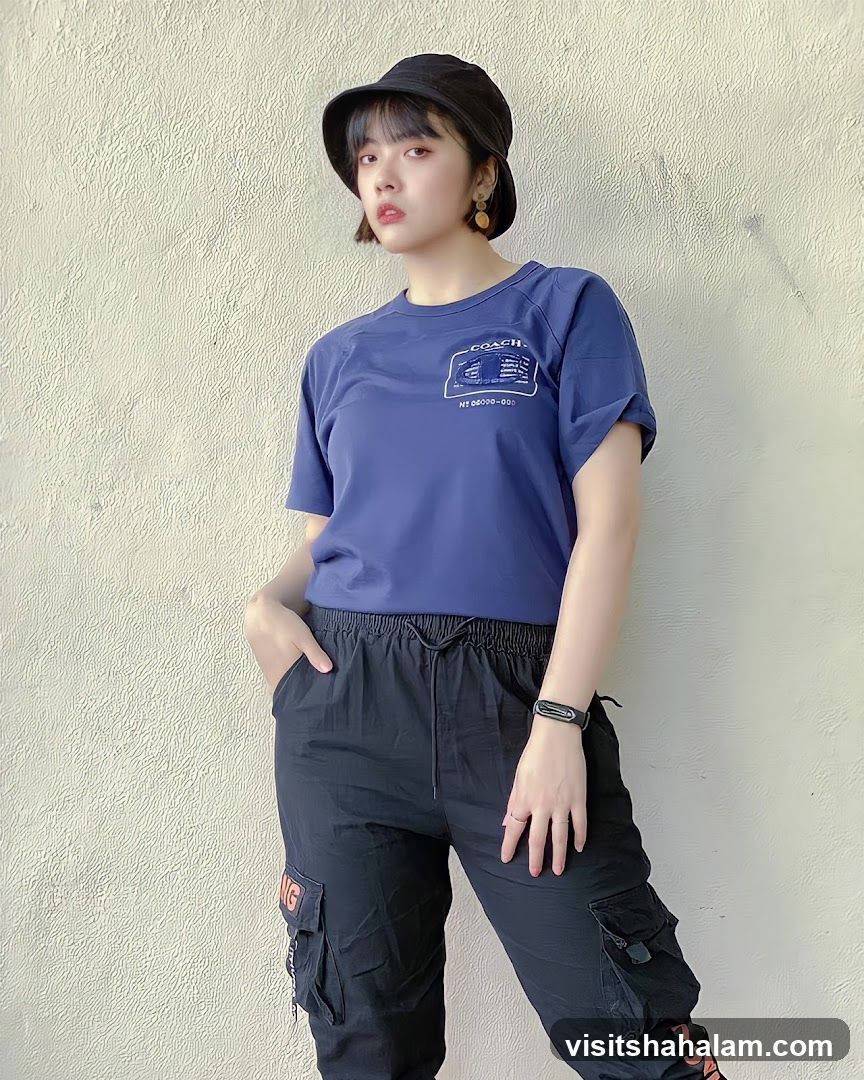 Woman in Blue T-shirt and Black Cargo Pants