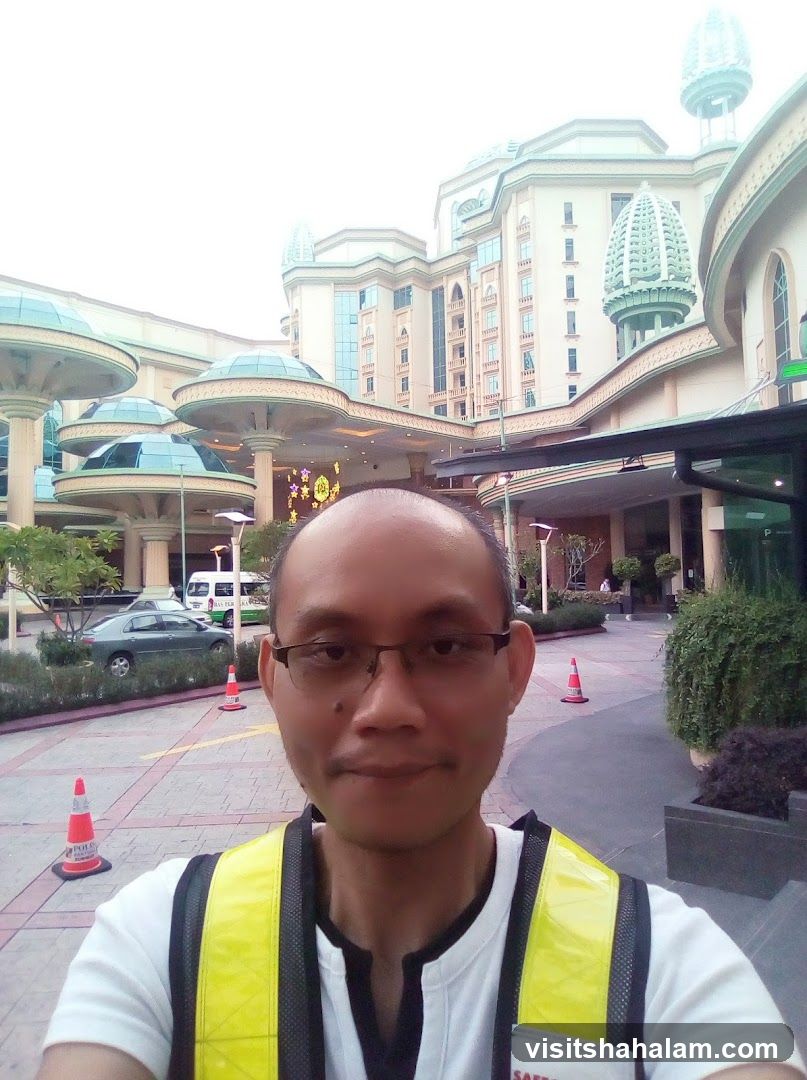 Man in front of a large building
