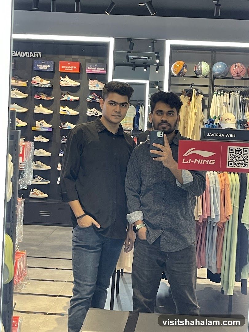 Two men taking a mirror selfie in a sports store