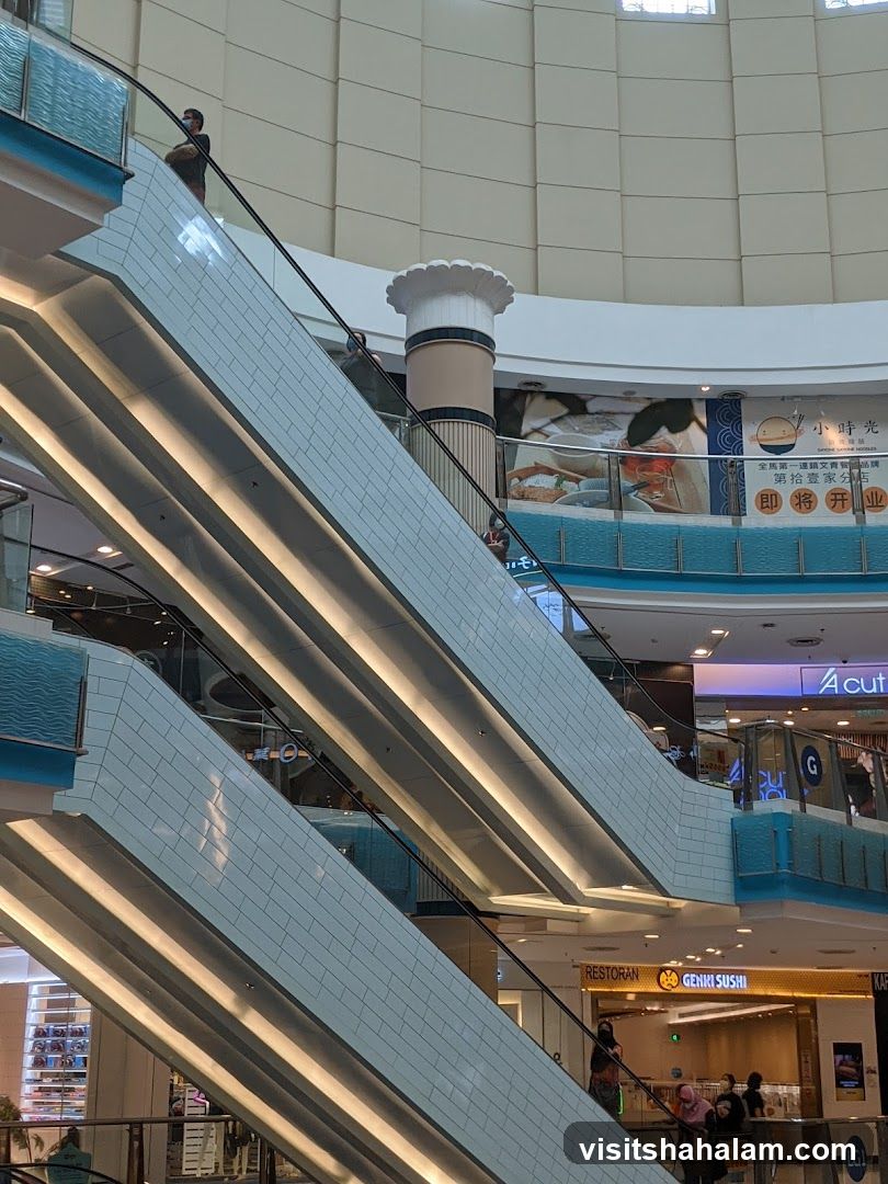 Mall Interior with Escalators and Shops