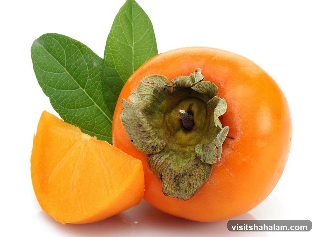 Persimmon with a slice and leaves