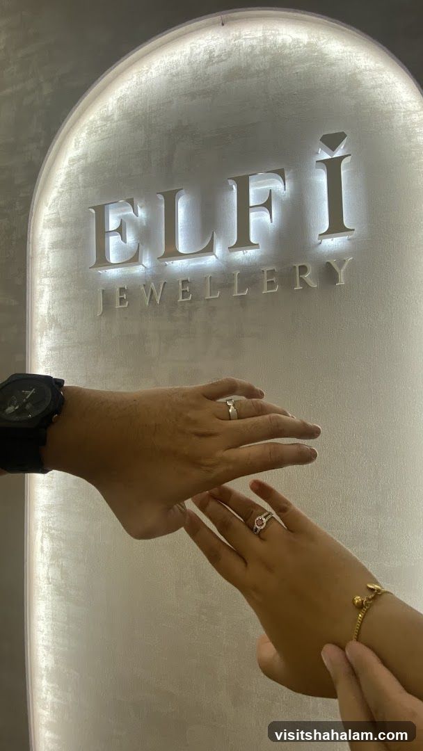 Jewellery store interior with hands displaying rings