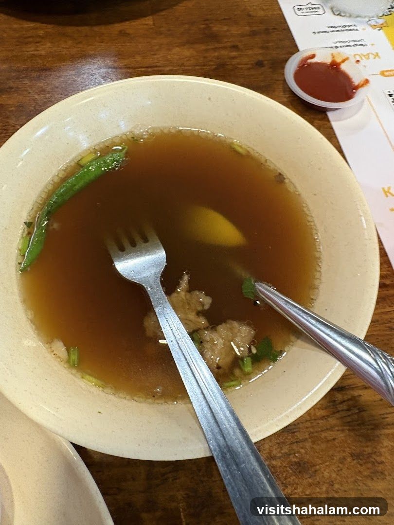 Bowl of Soup with Utensils