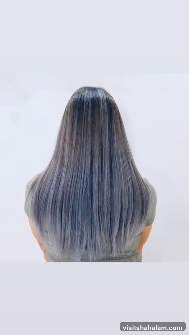 Woman with long, straight, ash-toned hair