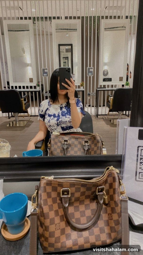 Woman taking a selfie in a salon