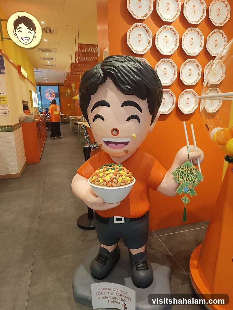 Statue of Uncle Roger holding a bowl of fried rice