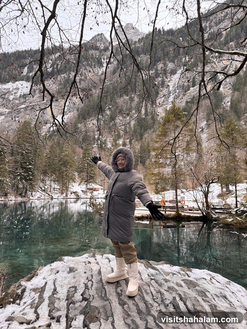 Woman Posing by a Lake in the Mountains