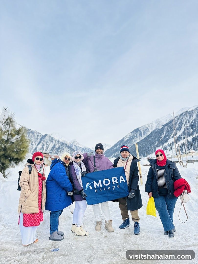 Group holding a banner in the snow