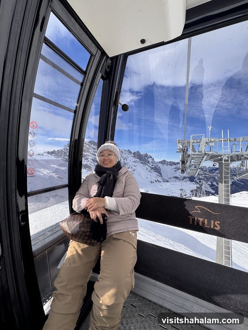 Woman in Cable Car with Mountain View
