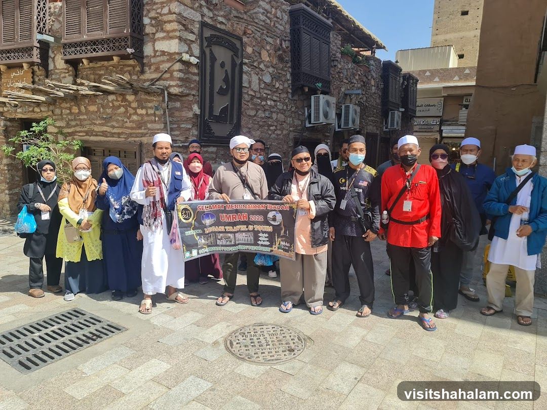 Group Posing with Umrah Banner
