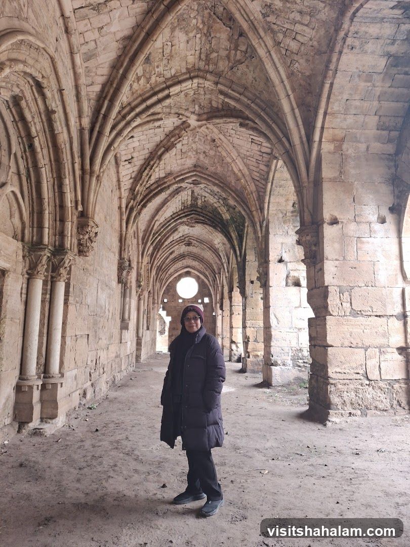 Woman Poses in Ruined Abbey