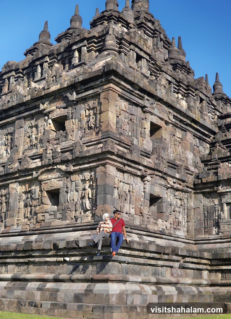 Couple sitting on ancient temple steps
